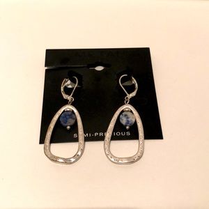 Silver earrings with blue stone bead.